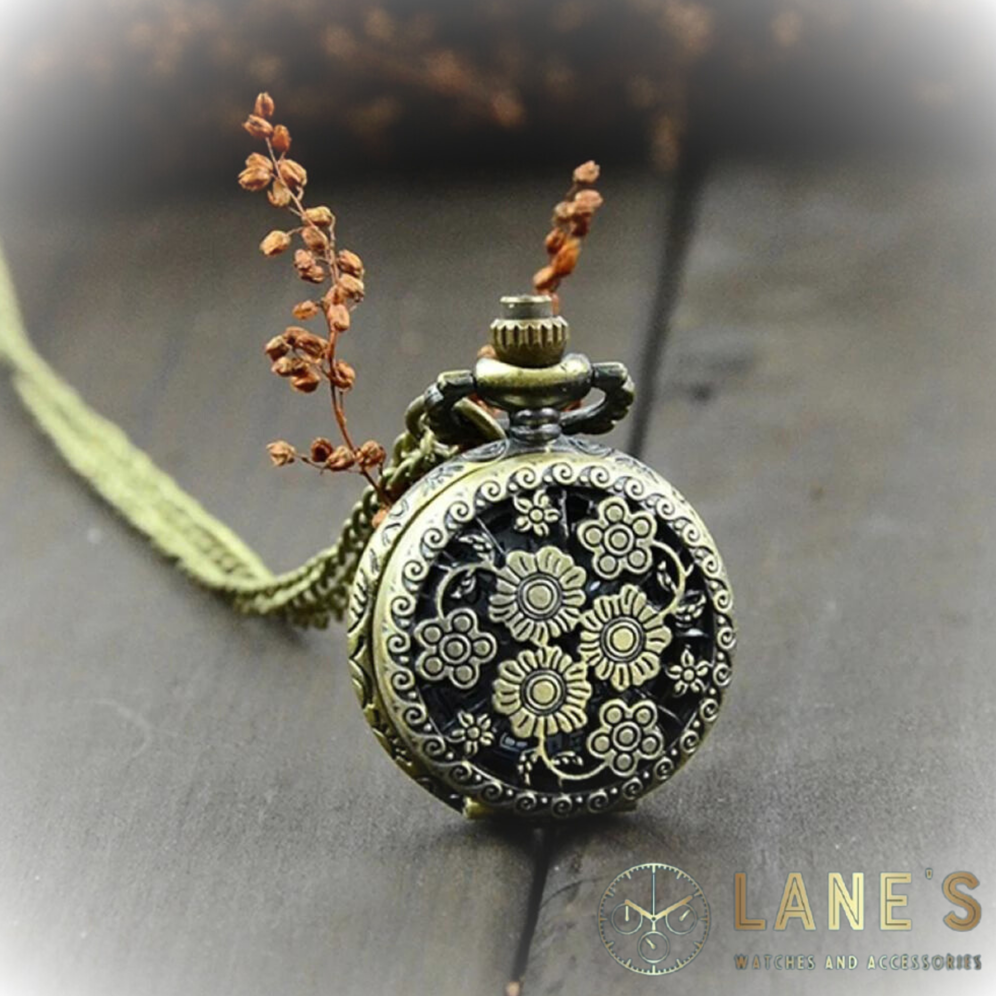 Antique Flower Pocket Watch showing the gold/bronze effect pocket watch with a chain and floral pattern