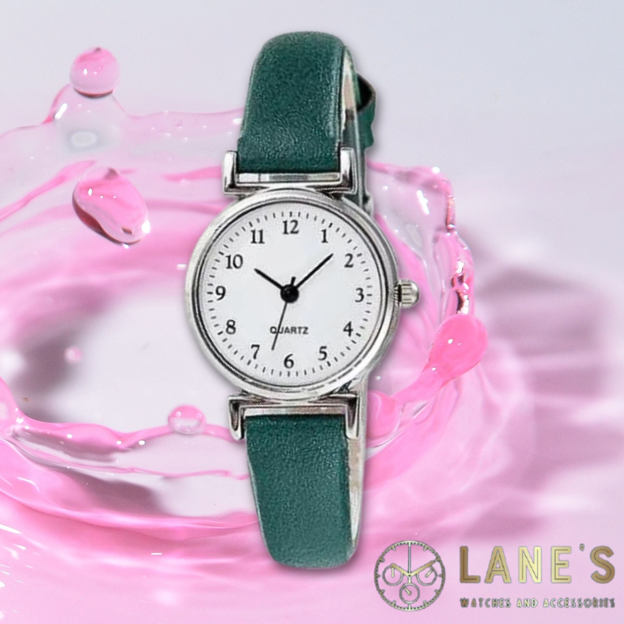 Green Meadow Ladies watch. Green strap, white face with silver trim. Numbers in black 1-12 with hour minute and second hands