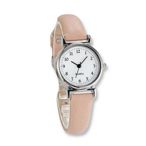 Perfectly Pink Ladies Watch featuring a pink strap, white face with black traditional numbers. 