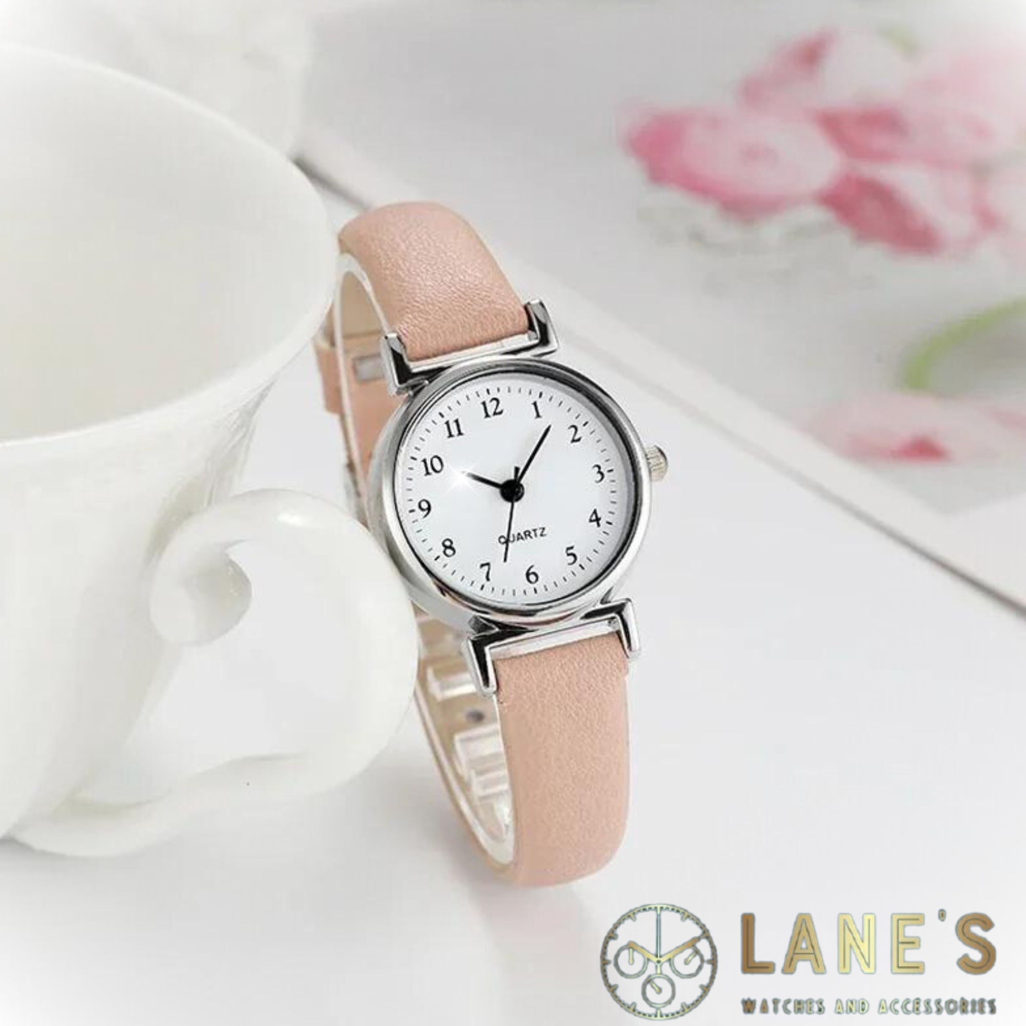 Perfectly Pink Ladies Watch featuring a pink strap, white face with black traditional numbers. 