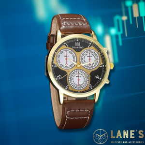 3 different clock faces on a black faced watch with white numbers and gold hands with a gold trim and a brown leather strap 