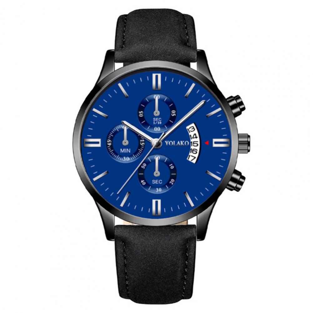 cobalt blue faced watch with silver markers representing numbers and a black velvety strap