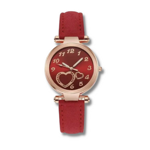 red faced watch with two gold hearts and gold numbers with a gold trim and a red faux leather strap on a white background